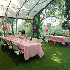 Tables decorated in pink awaiting a party.