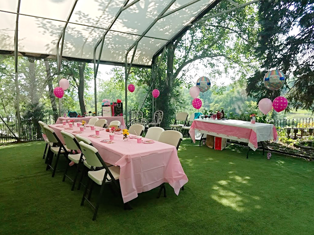 Tables decorated in pink awaiting a party.