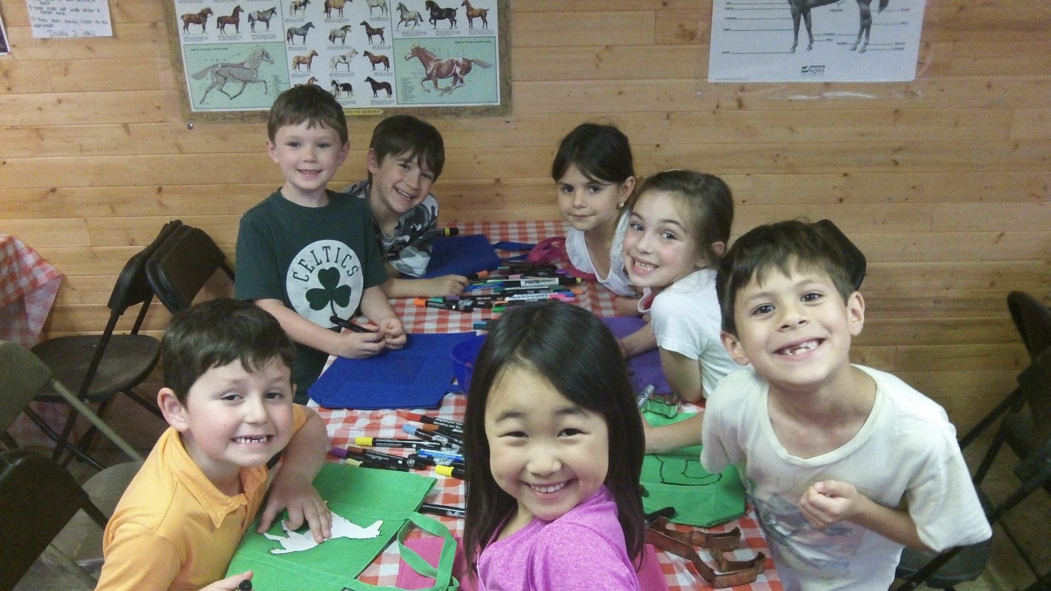 A group of kids making crafts.