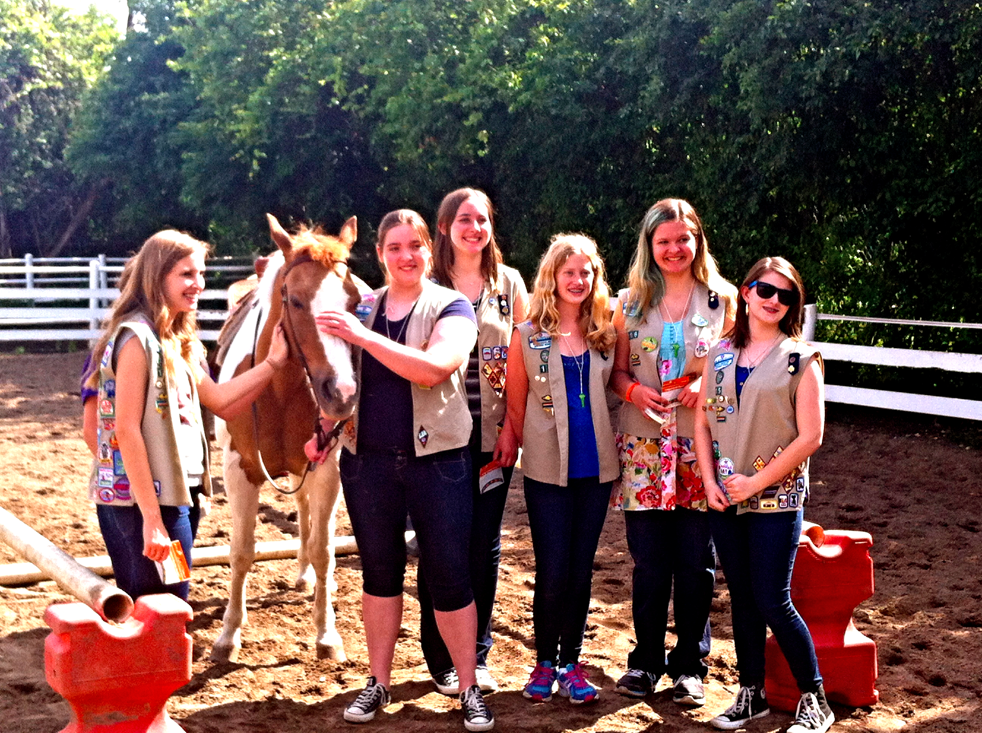 Girls scout with a horse.