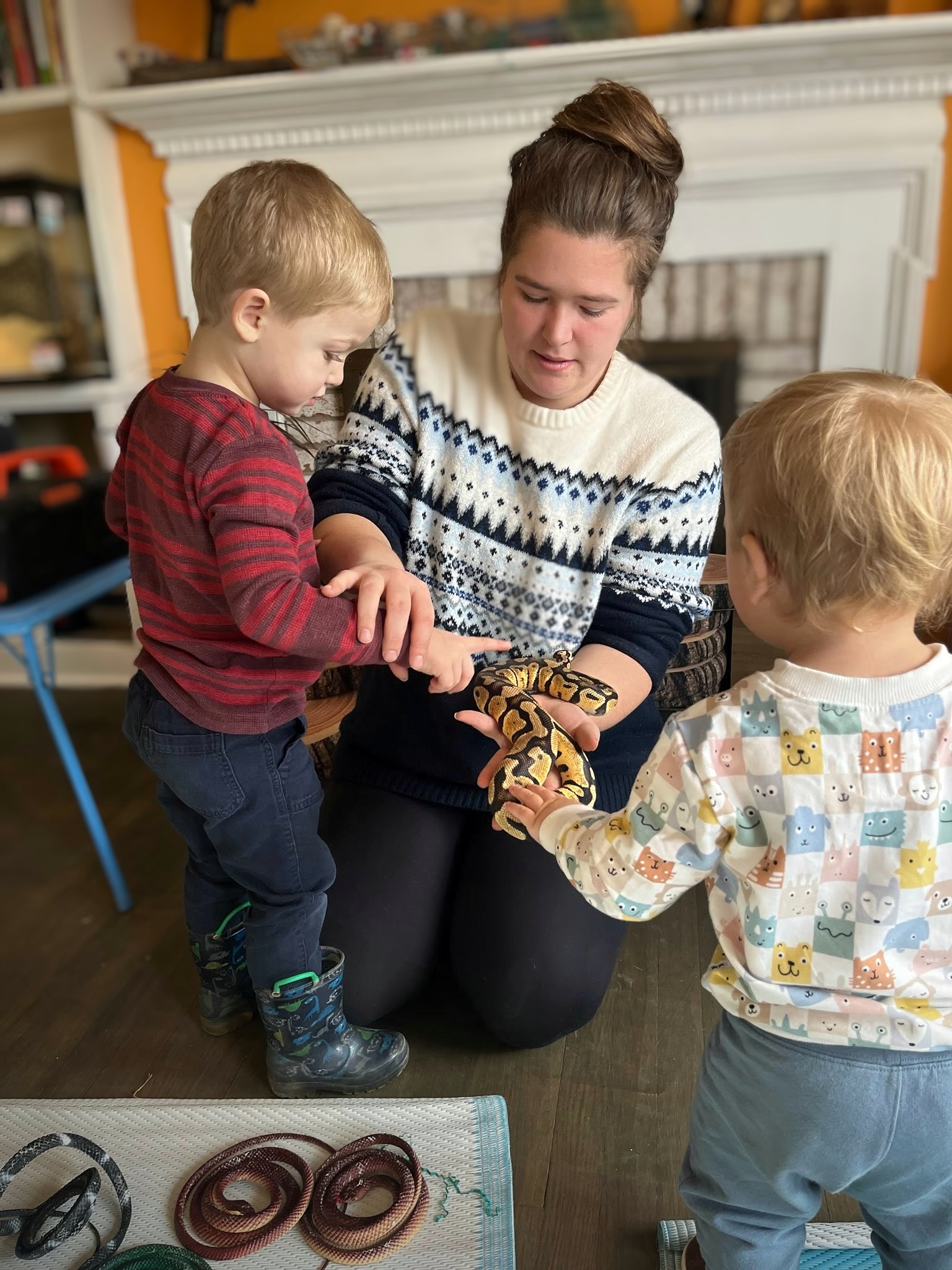 A young child wearing a crafted mask.
